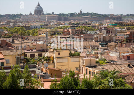 View from Terrazza del Pincio looking across the city skyline rooftop mixture of houses and apartment buildings towards Vatican city and the dome of S Stock Photo