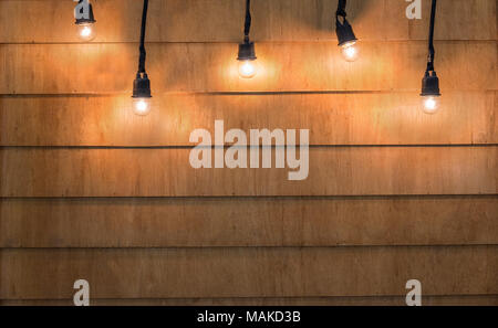 Light bulbs christmas on wood texture background. Light bulbs on wood background for product advertisement billboard concept. Celebration, Christmas,  Stock Photo