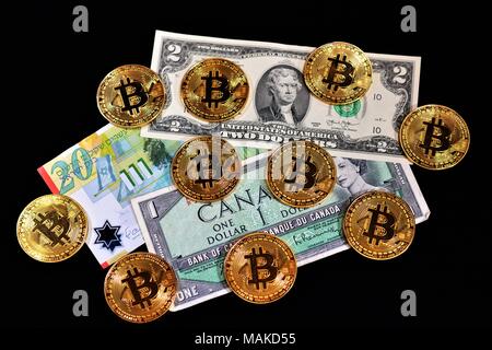 Bit coins with silver dollars and diamonds. Stock Photo