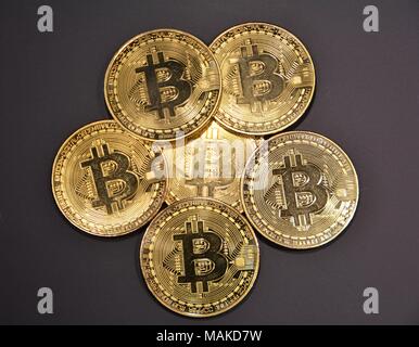 Bit coins with silver dollars and diamonds. Stock Photo