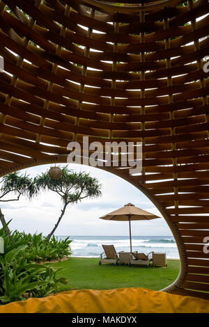 Cozy place inside cocoon hammock. View on tropical indian ocean. Stock Photo
