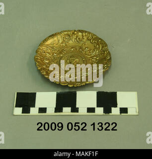 Small rounded gilt metal tray with a raised center image of the Thomas Jefferson and a scalloped border various flowers and vines. This is a souvenir from the 1904 World ?s Fair. Title: Small Rounded Metal Tray With Raised Image of the Jefferson and Floral Border  . 1904. Stock Photo