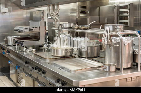 Modern stainless steel hobs in commercial kitchen Stock Photo