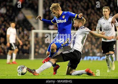 London, UK. 3rd April, 2018. Tim Ream of Fulham (R) tackles Samu Saiz of Leeds United (L). EFL Skybet championship match, Fulham v Leeds Utd at Craven Cottage in London on Tuesday 3rd April 2018.  this image may only be used for Editorial purposes. Editorial use only, license required for commercial use. No use in betting, games or a single club/league/player publications. pic by Steffan Bowen/Andrew Orchard sports photography/Alamy Live news Stock Photo