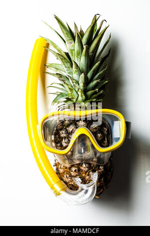 Pineapple in a snorkeling mask Stock Photo