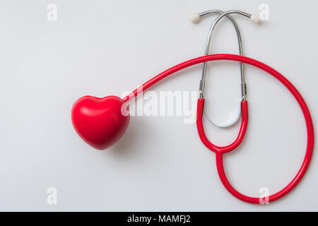 close up red heart and stethoscope on white background, world health day concept, process vintage tone Stock Photo