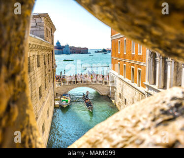 View from Bridge of Sighs Gondola Touirists Grand Canal Venice Italy Last view of prisoner to Venice prison.  Bridge between Doge's Palace and Prison Stock Photo