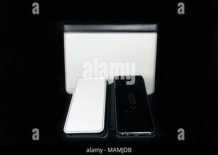 Foldable Phone and tablet Case, white and black leather blank on black backgroud for sublimation print design Stock Photo