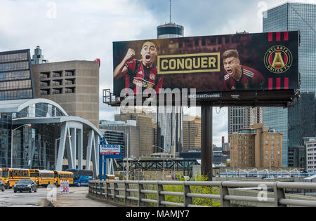 Atlanta city skyline with Atlanta United soccer billboard between State Farm Arena and the Mercedes-Benz Stadium in downtown Atlanta, Georgia. (USA) Stock Photo