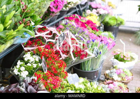 Flower bunches at a street market or market stall. Flower selling, flower market, flower bouquets. Stock Photo