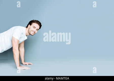 Nice strong man doing pushups Stock Photo