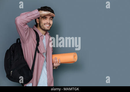 Nice joyful man having a walk Stock Photo