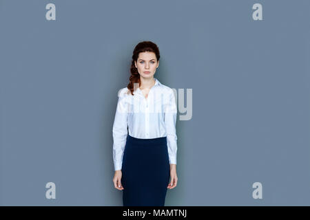 Smart confident businesswoman looking at you Stock Photo