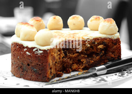 Simnel cake,  traditional at Easter,  on a cake stand with selective color Stock Photo