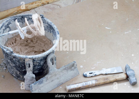 Construction tools on concrete background. Copy space for text. Set of assorted plaster trowel tools and spatula . Top view Stock Photo
