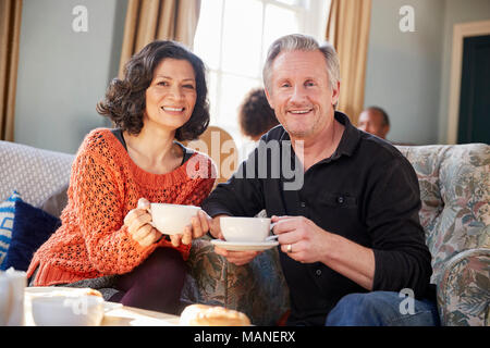 Portrait Of Middle Aged Couple Meeting In Coffee Shop Stock Photo