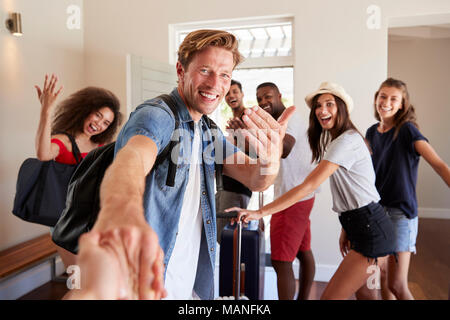 Point Of View Shot Of Friends Leaving Summer Vacation Rental Stock Photo