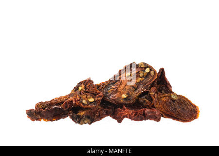 Dried tomatoes pile isolated on white background Stock Photo