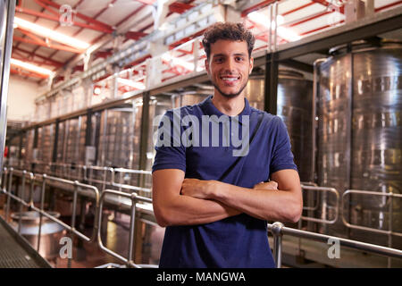 Portrait of a young Hispanic man working at a wine factory Stock Photo