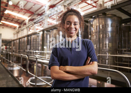 Portrait of young mixed race woman working at a wine factory Stock Photo