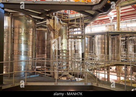 Spiral stairs in a modern winemaking facility interior Stock Photo