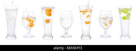 Glasses with clear sparkling water, citrus fruits splashes and bubbles set. Isolated on white, clipping path included Stock Photo