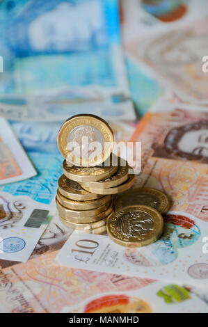 UK Sterling Currency - new notes and coins for 2018. new £1 coins and £5 and £10 notes currency for 2018 Stock Photo