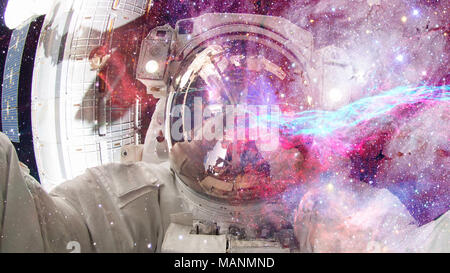 Astronaut in outer space. Elements of this image furnished by NASA. Stock Photo