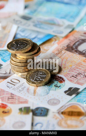 UK Sterling Currency - new notes and coins for 2018. new £1 coins and £5 and £10 notes currency for 2018 Stock Photo