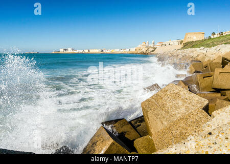 Atlantic waves breaking on the urbanized shore of old Cadiz, Andalusia, Spain