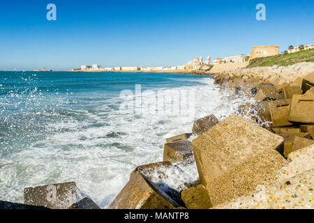 Atlantic waves breaking on the urbanized shore of old Cadiz, Andalusia, Spain