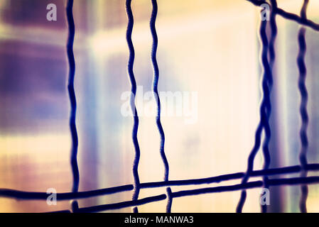 Fence with hole, wire fence, jail break scene. Stock Photo
