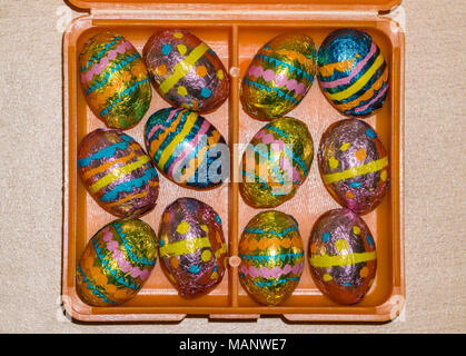 foil wrapped mini chocolate easter eggs in box Stock Photo