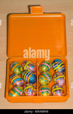 foil wrapped mini chocolate easter eggs in box Stock Photo