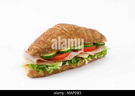 Croissant sandwich with cheese, ham and vegetables. Isolated on white background Stock Photo