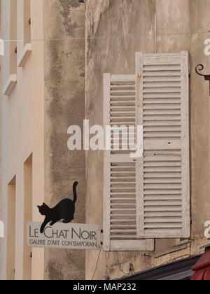 PARIS, FRANCE - MAY 07, 2011: Wooden shutters and Sign outside of the Le Chat Noir Art Galerie Stock Photo