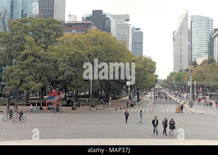 Pedestrians walk along the Paseo de la Reforma during the weekly Sunday morning car-free event giving the roads to walkers, bikers, and recreationists Stock Photo