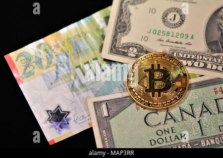 Bit coins with silver dollars and diamonds. Stock Photo