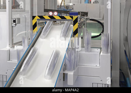 Plastic Cup Manufacture Production in Factory Stock Photo