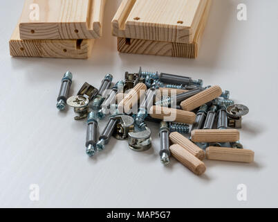 An assortment of flat pack furniture fixings Stock Photo