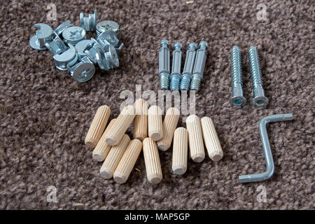 An assortment of flat pack furniture fixings Stock Photo