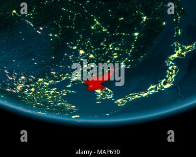 North Korea on night planet Earth with visible country borders in hands ...