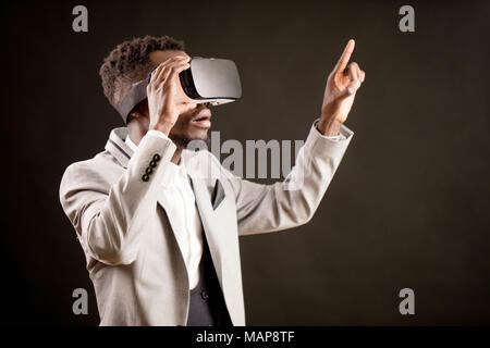 side view close up image of Afro male with virtual reality glasses Stock Photo