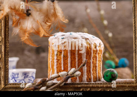 Fresh, beautiful, home, Easter cake close-up. Willow twigs and Easter cake for the holiday. Stock Photo