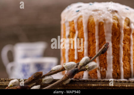 Fresh, beautiful, home, Easter cake close-up. Willow twigs and Easter cake for the holiday. Stock Photo