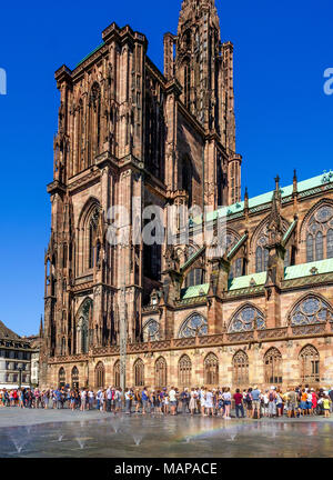 Tourists queueing to visit cathedral, water jet fountain, summer, blue sky, Strasbourg, Alsace, France, Europe, Stock Photo