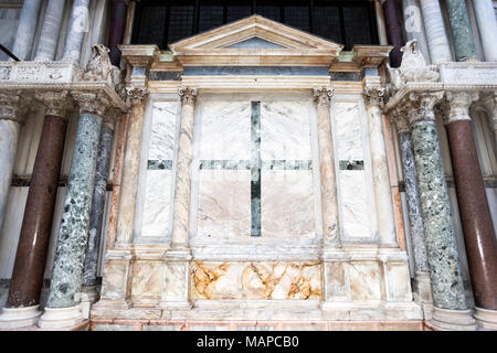 marble cross ornament on the wall of famous St.Mark’s Basilica in Venice, Italy Stock Photo