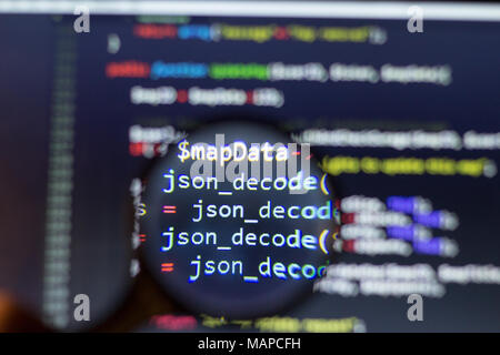 PHP back-end code zoomed through a magnifier. Computer programming ...