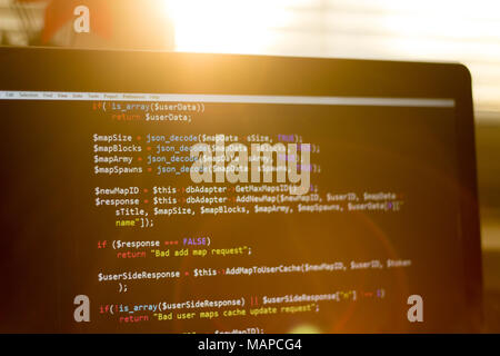 PHP code close up. Web development screen in sunset rays Stock Photo