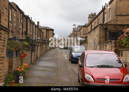 Back to back terraced houses built before the invention of the motor car in the  Victorian model village of Saltaire, Yorkshire Stock Photo